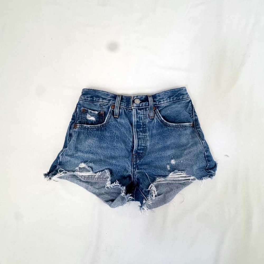 Vintage late 90's Levis denim micro shorts with distressed hems and tears